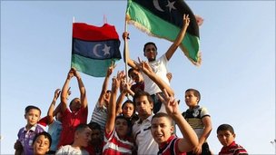 Children celebrate the fall of Tripoli, in Janzour, August 23, 2011.