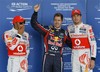 Red Bull driver Sebastian Vettel of Germany, center, celebrates after taking pole position for Sunday's Japanese Formula One Grand Prix, with second placed McLaren driver Jenson Button of Britain, right, and third placed McLaren driver Lewis Hamilton of Britain at the Suzuka Circuit in Suzuka, central Japan, Saturday, Oct. 8, 2011.