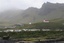 Vik, a small Icelandic town of just 300 people, where residents still recall stories from their relatives of Katla volcano's last eruption in 1918, sits under a blanket of cloud in this Sept. 27, 2011 photo.