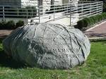 Boulder next to East College. The Boulder Run has become a tradition at DePauw University. Students, streaking from their respective residences, run to and from the Columbia Boulder, located in the center of the campus near the East College building.