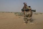 An assault Marine with Echo Company, Battalion Landing Team 2nd Bn., 8th Marines, 26th Marine Expeditionary Unit (26th MEU), fires an AT-4 anti-tank rocket during a live fire training on a range at Udairi Range, Kuwait.