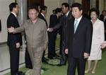 South Korean President Roh Moo-hyun, right, and his wife Kwon Yang-sook, rear, are escorted by North Korean leader Kim Jong Il, left, for the farewell luncheon venue after exchanging a joint declaration documents in Pyongyang, North Korea, Thursday, Oct.