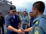 Commanding Officer, USS Paul Hamilton (DDG 60), Cmdr. Werner Jurinka, welcomes Indonesian Navy Capt. Salim of Tentara Nasional Indonesia Anekatan Laut to his ship for a tour.