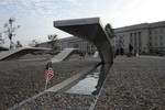 091002-M-5085G-067       A small American flag stands near a bench at the Pentagon Memorial on Oct. 2, 2009.  DoD photo by Cpl. Christopher A Green, U.S. Marine Corps.  (Released)