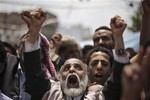 Protestors shout slogans during a demonstration demanding the resignation of President Ali Abdullah Saleh in Sanaa, Yemen, Thursday, Sept. 15, 2011.