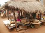 Village in Africa .On this image, we can see the life of its people. Gboto est un village à 90 km de Lomé la capitale. Sur ces images, nous pouvons voir le quotidien de ses habitants. une femme sous une chamiere dans le marché Togo, Africa on Wednesday, August 3, 2011.