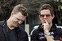 Collingwood assistant coach Nathan Buckley (left) talks to Luke Ball