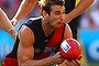 Jobe Watson in action against the Sydney Swans at ANZ Stadium