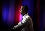 President Barack Obama pauses as he speaks at the Aragon Ballroom, Wednesday, Aug. 3, 2011, in Chicago, at a fundraiser on the eve of his 50th birthday.