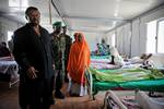 SOMALIA, Mogadishu: In a handout photograph released by the African Union-United Nations Information Support Team, Chairperson of the African Union Commission Jean Ping visits wounded Transitional Federal Government (TFG) soldiers at the African Union Mission in Somalia (AMISOM) Level II hospital at the operation's headquarters in Mogadishu 20 August, during a one-day visit to the Somali capital. Ping, who meet with AMISOM commanders the leadership of the Transitional Federal Government (TFG), s