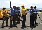 Sailors conduct a firefighting training exercise aboard USS Enterprise (CVN 65).