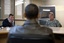 President Barack Obama meets with U.S. Ambassador Karl Eikenberry, left, and Gen. Stanley McChrystal at Bagram Air Field in Afghanistan, March 28, 2010.