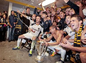 Los Angeles Galaxy midfielder David Beckham, bottom left, celebrates with his teammates after the Galaxy defeated the Houston Dynamo in the MLS Cup championship soccer match, Sunday, Nov. 20, 2011, in Carson, Calif.