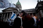 A gay couple kisses outside Argentina's congress during a rally to support a proposal to legalize same-sex marriage in Buenos Aires, Wednesday, July 14, 2010.