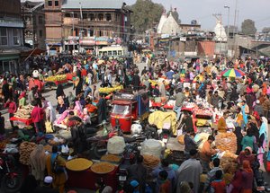 Kashmiri shoppers throng an outdoor market ahead of the  Eid-al-Adha festival in Srinagar on November 05, 2011.