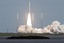 NASA's Mars Science Laboratory spacecraft, sealed inside its payload fairing atop the United Launch Alliance Atlas V rocket, clears the tower at Space Launch Complex 41 on Cape Canaveral Air Force Station in Florida, 26 November, 2011.