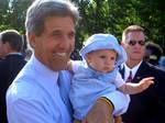 John Kerry holding a supporters baby on campaign in Rochester, Minnnesota