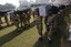 Pakistan army soldiers carry coffins of Saturday's NATO attack victims for funeral in Peshawar, Pakistan on Sunday, Nov 27, 2011.