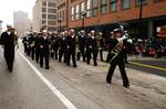 Musician 1st Class Jennifer Lange, from Rockford, Ill., the drum major for the U.S. Navy Band Great Lakes marching band, leads musicians to the beginning of the Chicago Thanksgiving Day Parade.