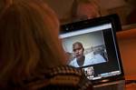 In this photo taken Friday, July 9, 2010, American Sherrie Cramer, 56, talks with her daughter Katie, 16, on Skype at her hotel room in Liuzhou in southern China's Guangxi region. Sherrie Cramer is in China to search for a bone marrow or stem cell donor for her adopted daughter who is fighting leukemia. The teenager from Sacramento, Calif. has no known blood relatives, and her best chance of a match will be someone from her Zhuang ethnic group, China's largest minority of 16 million.