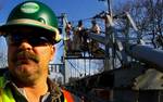 Workers from a private company hired by the New York State Department of Transportation, (N.Y.S.D.O.T.) open sections of the main cables for inspection in April of 2008