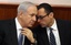 Israeli Prime Minister Benjamin Netanyahu, left, talks with Cabinet secretary Tzvi Hauser during the weekly cabinet meeting in Jerusalem, Sunday, Dec. 4, 2011.