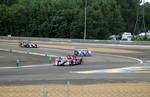 A group of Le Mans Prototypes at Mulsanne Corner during the early laps. The race began at 3:00 pm local time (GMT+1), with the track still damp following a wet morning warm-up.