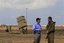 File - U.S. ambassador to Israel Daniel Shapiro, left, speaks with Colonel Zvika Haimovitch, head of active air defense of the Israeli army, during Shapiro's visit to the Iron Dome missile defense system deployed in the costal city of Ashkelon, Israel, Tuesday, Aug. 9, 2011.