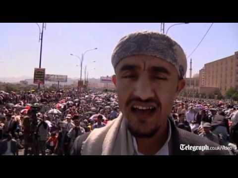 Heavy clashes in Yemeni city of Taiz as thousands of protesters take to the streets of Sanaa