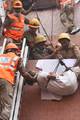 Rescue workers evacuate a patient as a fire engulfs the Advance Medicare and Research Institute (AMRI) hospital in the eastern Indian city of Kolkata on December 9, 2011. At least 70 people were killed when a fire engulfed a hospital Friday in the eastern Indian city of Kolkata, with many victims believed to be patients who died of smoke inhalation in Eastern India City