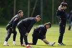 Manchester United's Cristiano Ronaldo, centre left, is seen with Carlos Tevez, centre right, Ryan Giggs, left, and Park Ji-Sung as they train with teammates at Carrington training ground before the team's forthcoming Champions League Final, Manchester, England, Wednesday May 20, 2009. Manchester United will play Barcelona in the final of the Champions League in Rome on May 27.