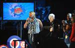 Queen Latifah introduces family members of the U.S. Army National Guard 261st Signal Brigade to their loved ones deployed in Iraq via satellite at the “Kids Inaugural: We Are the Future” concert at the Verizon Center in downtown Washington, D.C., Jan. 19, 2009