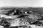 Israeli soldiers with the fortress of Iraq Suwaydan in the distance