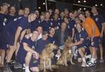 A Sacremento, California Urban Search and rescue team pause for a picture with Chevy Chase who came to offer his thanks for their work at w:World Trade Center, 20 September 2001