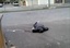 In this image from TV made available Thursday Dec. 15, 2011, showing a man lying dead in the street in Homs, Syria, Wednesday Dec. 14, 2011.