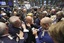 Traders crowd the post that handles Berkshire Hathaway on the floor of the New York Stock Exchange Friday, June 25, 2010