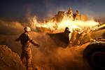 A bulldozer moves the berm surrounding a guard post at Firebase Saenz, Helmand province, Afghanistan.