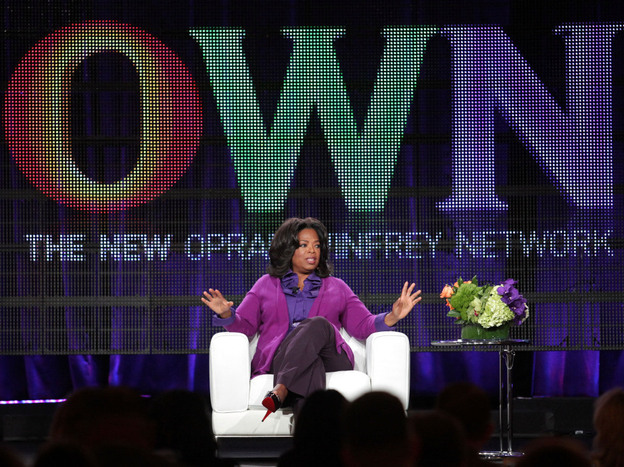 Oprah Winfrey talks to reporters during a press tour that followed the launch of her cable network, OWN, in January.