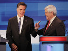 Former Speaker of the House Newt Gingrich and former Massachusetts Gov. Mitt Romney chat after finishing a GOP debate in Sioux City, Iowa, earlier this month. 