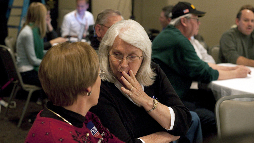 Potential caucus-goers Janet Erwin, center, and Celma Higgins attend a campaign event for Texas Gov. Rick Perry in Indianola, Iowa.