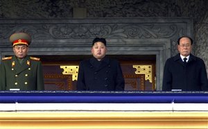 In this photo taken Thursday, Dec. 29, 2011, new North Korean leader Kim Jong Un, center, presides over a national memorial service for his late father Kim Jong Il at Kim Il Sung Square in Pyongyang, North Korea.