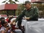 Venezuela's President Hugo Chavez greets supporters as he passes through the town of La Fria, on his way to La Grita, Venezuela, Thursday Oct. 20, 2011.