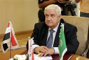 Syrian Foreign Minister Walid Moallem attends a meeting with Arab League Secretary-General Amr Moussa, Iraqi Foreign Minister Hoshyar Zebari, and Turkish Foreign Minister Ahmet Davutoglu, not pictured, to discuss the recent Syria-Iraq political tensions, at the Arab League headquarters in Cairo, Egypt Wednesday, Sept. 9, 2009.