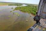 Sgt. John Vorrath, Charlie Company, 2nd of the 147th Aviation Battalion, Iowa Army National Guard, operates a sling on a UH-60 Blackhawk above the swollen Missouri River. Iowa National Guard soldiers from central Iowa have been placed on state active duty to assist local and state authorities in the western Iowa town of Sioux City, Iowa, and North Sioux City, S.D. Guardsmen from the Iowa National Guard are working with their counter parts from the South Dakota National Guard to protect private p