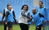 Manchester City's Carlos Tevez, center, in action during an open training session held at the City of Manchester Stadium, Manchester, England