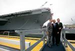 President George W. Bush, father President George H. W. Bush and brother Florida Governor Jeb Bush depart at the conclusion of the Christening Ceremony for the George H.W. Bush (CVN 77) in Newport News, Virginia, Saturday, Oct. 7, 2006.