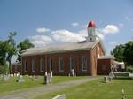 St. Alphonsus Catholic Church; the monument is in front of the church in this picture