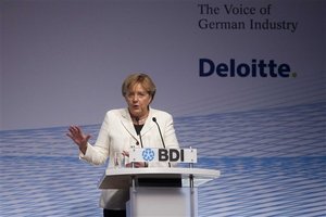 German Chancellor Angela Merkel delivers her a speech at the annual conference of the Federation of German Industry (BDI) in Berlin, central Germany, Tuesday, Sept. 27, 2011.