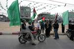 Palestinian Hamas militants patrol in the streets during the celebrations marking the Islamist movement's 24th founding anniversary, in the Rafah refugee camp in the southern Gaza Strip on December 19, 2011.Photo by Ahmed Deeb/wn