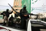 Palestinian Hamas militants patrol in the streets during the celebrations marking the Islamist movement's 24th founding anniversary, in the Rafah refugee camp in the southern Gaza Strip on December 19, 2011.Photo by Ahmed Deeb/wn